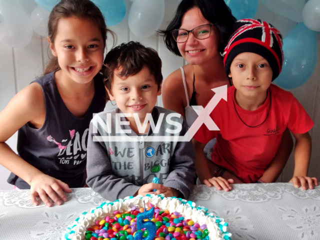 William Gabriel Souza Lopes, 5, (second from the left)  and unidentified children pose in undated photo. He  died after inhaling a party balloon, in Porto Belo, Brazil, on Tuesday, Oct. 4. 
Note: Private photo.  (@alitaSouza1987/Newsflash)