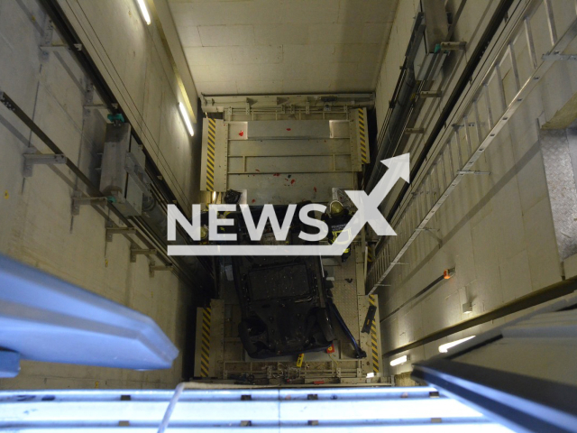 Image shows the vehicle stuck in the elevator shaft, undated photo. A woman crushed her vehicle in an elevator shaft in the city of Stuttgart, Germany on Saturday morning, Oct. 8, 2022. Note: Licensed content. (Feuerwehr Stuttgart/Newsflash)