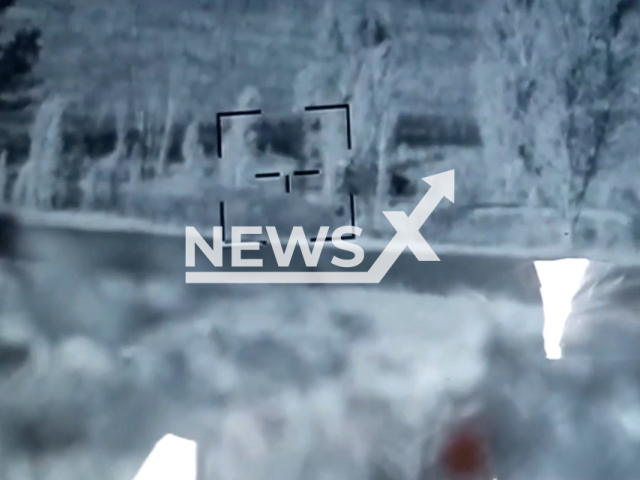 Russian tank goes down the road near trees in Ukraine in undated photo. Soldiers of the 92nd separate mechanized brigade named after the Kosh chieftain Ivan Sirko detected and destroyed Russian tank. Note: Picture is a screenshot from a video (@92OMBr/Newsflash)