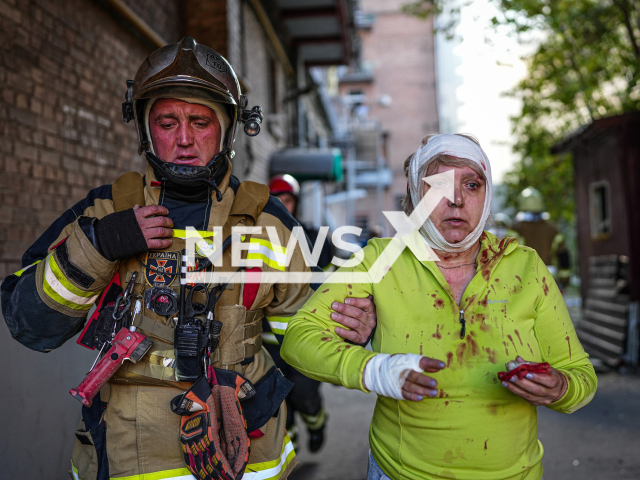 Ukrainian rescuer holds hand of wounded woman in Ukraine, Monday, Oct. 10, 2022. As a result of Russian rocket attacks, 11 people died and 64 were injured, there is no electricity supply in 4 regions of Ukraine. Note: Photo is obtained from the State Emergency Service of Ukraine.(@MNS.GOV.UA/Newsflash)