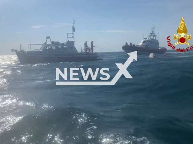 Water rescuers help crew in need in the waters of the Gulf of Trieste, Italy. Note: Picture is a screenshot from video. (Vigili del Fuoco/Newsflash)