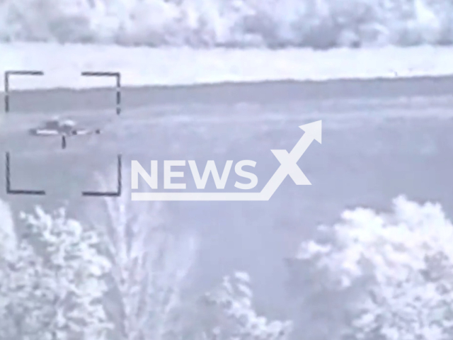 Russian tank goes down the road near trees in Ukraine in undated photo. Soldiers of the 92nd separate mechanized brigade named after the Kosh chieftain Ivan Sirko detected and destroyed two Russian tanks. Note: Picture is a screenshot from a video (@92OMBr/Newsflash)