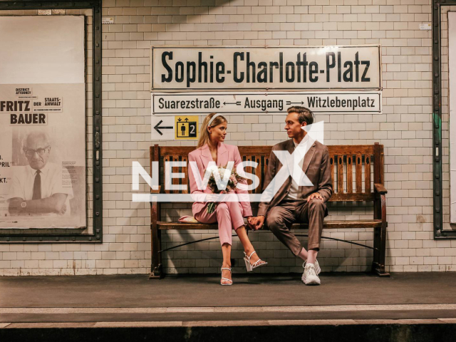 Luise Jäsche, 24, wearing the pink suit, pictured on the her wedding day with her husband Benjamin. Note: We obtained license for this photo.(@luisejsch/Newsflash)