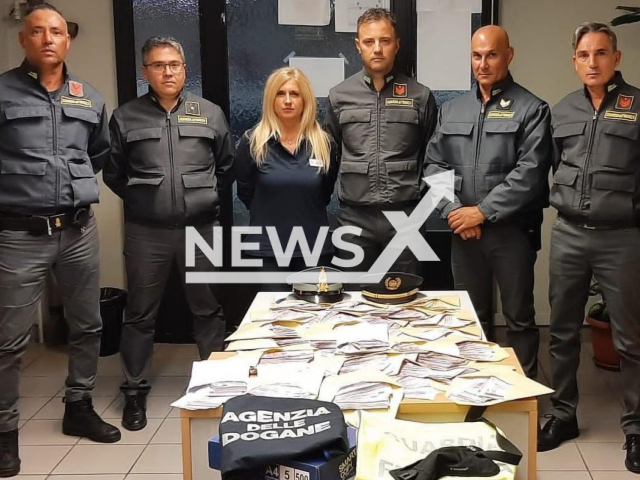 Image shows Italian customs officers, undated photo. They caught a married couple entering Italy through Switzerland by train with over EUR 1.4 million (GBP 1.2 million) in cash in their luggage on Friday, Oct. 14., 2022. Note: Licensed content. (Agenzia Accise Dogane e Monopoli/Newsflash)