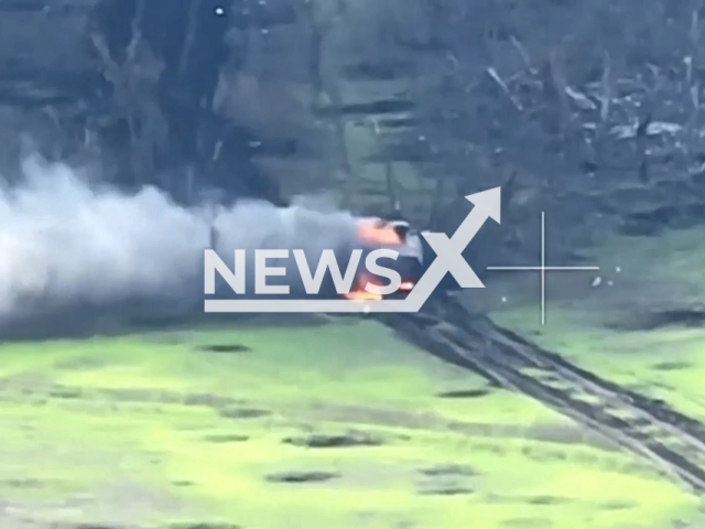 Russian MT-LB multi-purpose, fully amphibious, tracked armored fighting vehicle burns on a road in a field area in Donetsk region, Ukraine in undated photo. Artillery paratroopers of the 79th separate amphibious assault brigade of Mykolaiv burned down two Russian MT-LB armored vehicles. Note: Photo is screenshot from a video (@www.dshv.mil.gov.ua/Newsflash)