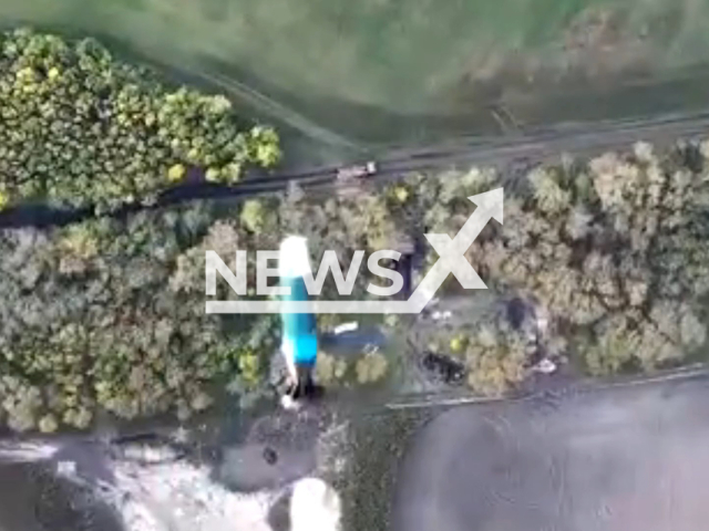 Missile flies to position of Russian soldiers in a forested area in Ukraine in undated photo. Fighters of aerial reconnaissance of the 40th Separate Artillery Brigade named after Grand Duke Vytautas detected Russian soldiers digging dugout and dropped bombs from drone on them. Note: Picture is a screenshot from a video (@40OAbrigade/Newsflash)