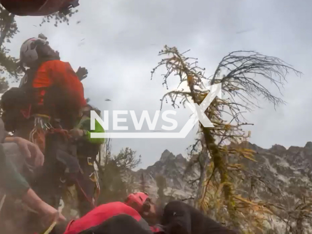 Crew rescue a hiker in Washington, the USA on Monday, Oct.10, 2022. Note: Picture is a screenshot from a video. (Wenatchee Valley Firefighters, Local 453/Newsflash)