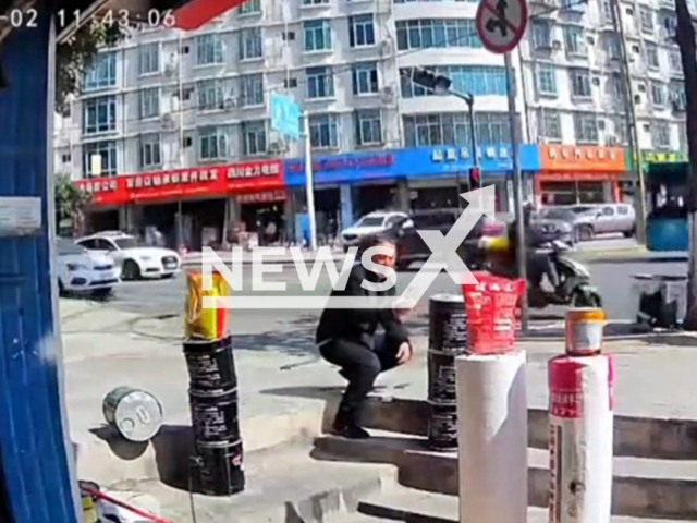 Man avoids being crashed by lorry that loses control and slams into shop in Panzhihua, China. Note: Picture is a screenshot from a video (AsiaWire)