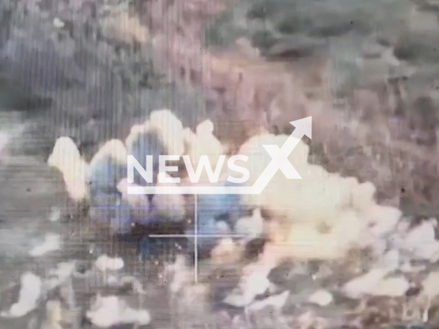 Russian tank explodes in a field area in Ukraine in undated photo. Fighters of the 44th separate artillery brigade named after Hetman Danylo Apostol destroyed Russian control post, two tanks, an infantry fighting vehicle and an armored personnel carrier. Note: Picture is a screenshot from a video (@44art.br/Newsflash)