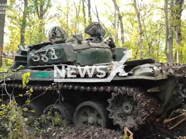 Picture shows abandoned Russian tank in a forested area on the north of Donetsk region of Ukraine in undated photo. Ukrainian border guards showed abandoned Russian military equipment, weapons and ammunition on liberated territories of Donetsk region. Note: Picture is a screenshot from a video (@DPSUkraine/Newsflash)