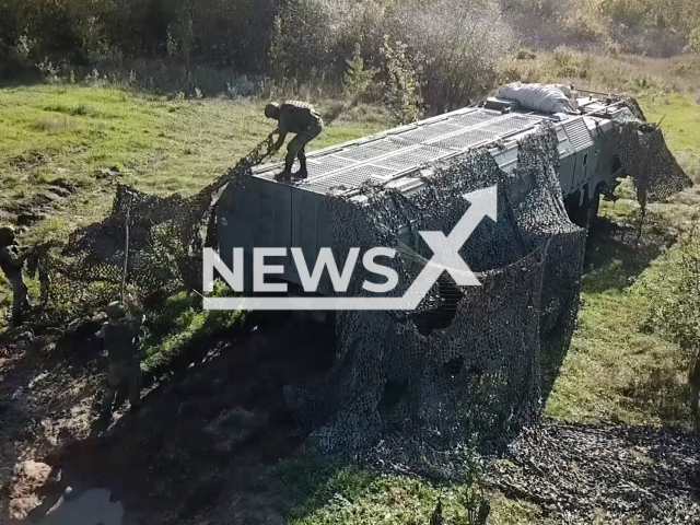 Russian Iskander-M crew prepares the mobile short-range ballistic missile system for firring mission in Ukraine in undated footage. The 9K720 Iskander is a mobile short-range ballistic missile system produced and deployed by the Russian military. Note: This picture is a screenshot from the video. (Ministry of Defense of Russia/Newsflash)