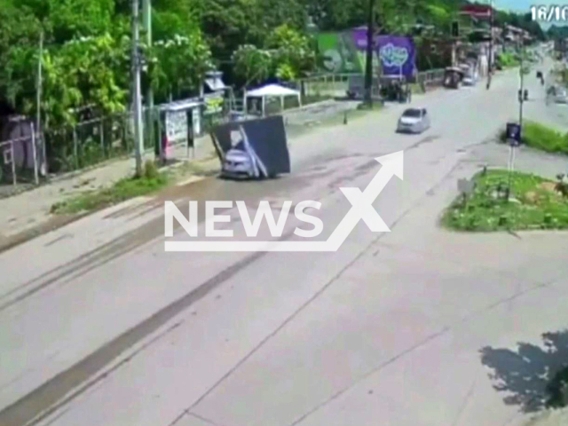 Driver drives with motel gate stuck on car in Olinda, Brazil, on Sunday, Oct. 16, 2022. He drove trough the city after  he fled a motel  without paying.  Note: Photo is a screenshot from a video.(Newsflash)