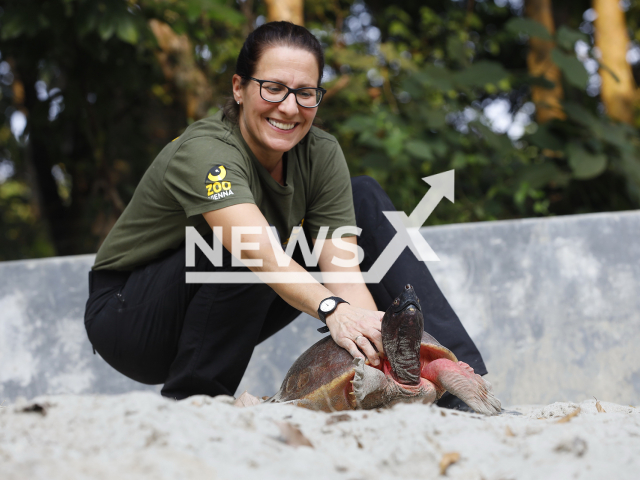 Researcher Doris Preininger at the reintroduction of the Northern river terrapin in Bangladesh, poses in undated photo. The Vienna Zoo in Austria began the conservation project for the northern river terrapin in 2010. Note: Licensed content. (Rupert Kainradl/Newsflash)