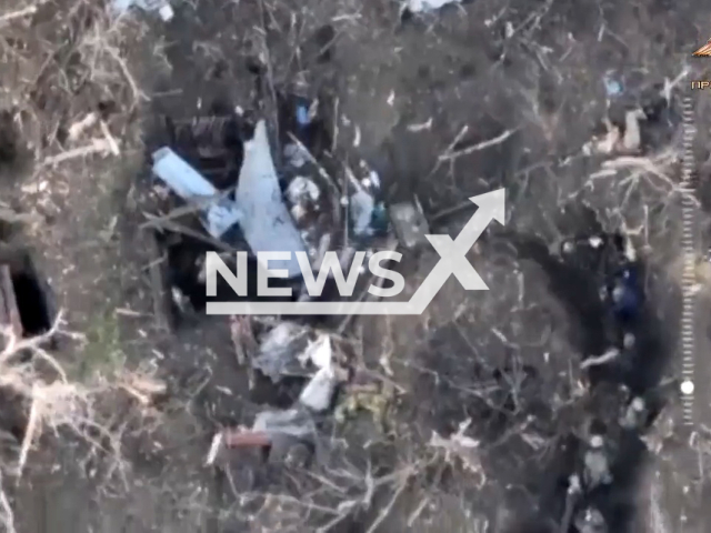 DPR soldiers inspect dugouts of Ukrainian army in a  field area in Ukraine in undated photo. Soldiers of Sparta battalion of the People's Militia of the DPR captured Ukrainian soldier. Note: Picture is a screenshot from a video (@nm_dnr/Newsflash)