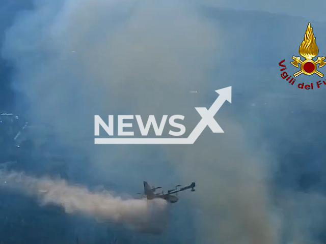 Italian firefighters use a Canadair aircraft in a fire-extinguishing intervention that lasted for more than 20 hours as a raging wildfire burned through an Italian forest. The Monte degli Elci fire that has been burning since the afternoon of Oct. 18, 2022 near Rome, Italy.  Note: Picture is screenshot from a video (Vigili del Fuoco/Newsflash)