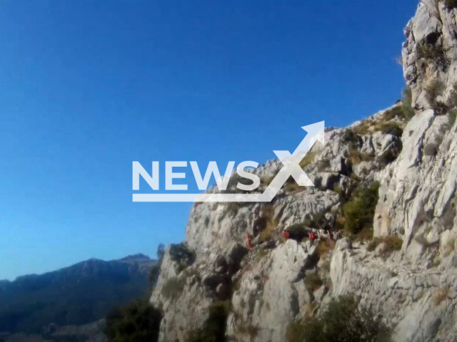 Picture shows mountaineers climbing on Puig Roig, in Spain. A 75-year-old Irish woman died  in Escorca after suffering an accident while on an excursion in the area on Sunday, Oct. 23, 2022.   Note: Photo is a screenshot from a video. (Newsflash)