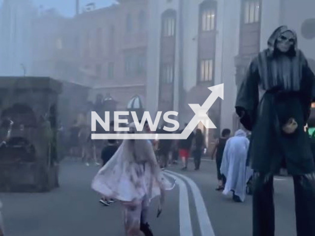 Picture shows people dressed in costumes at the Halloween Horror Nights event at Universal Studios Florida, in Florida, US, on Sept. 2, 2022. The person dressed as a skeleton was wearing stilts in order to appear taller. Note: Picture is a screenshot from a video (@freaks_of_hhn/Newsflash)