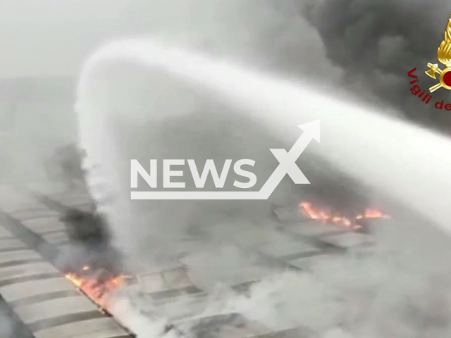 The warehouse fire in Corana, Italy on Friday, Oct. 21, 2022. Note: Photo is a screenshot from a video.(Vigili del Fuoco/Newsflash)