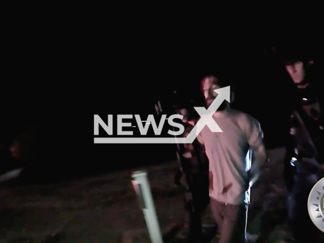 Police officers arrests an armed suspect after a night-long standoff at his home in Nashville, Tennessee, USA in undated video. Note: Picture is a screenshot from the video. (Metropolitan Nashville Police Department/Newsflash)