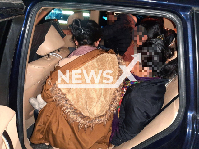 Image shows eight Kurdish migrants crammed in the backseat of a car, undated photo. The 48-year-old smuggler was temporary arrested in Bavaria, Germany on Monday, Oct. 24, 2022. Note: Licensed content. (Bundespolizei/Newsflash)