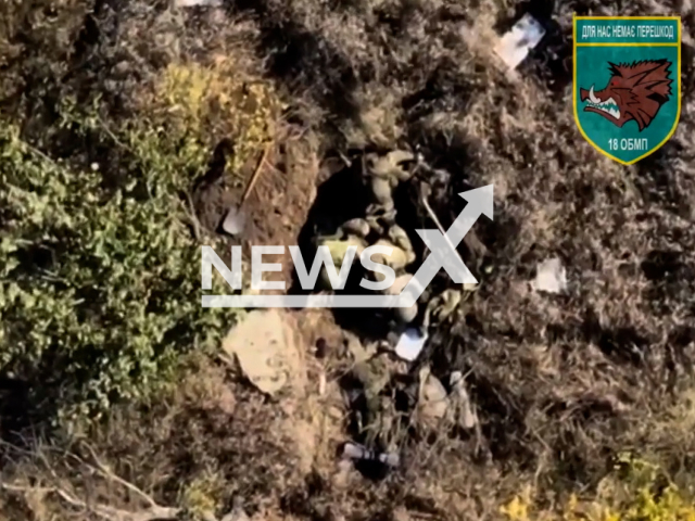 Picture shows sleeping Russian soldiers in a trench before were woken up by the Ukrainian marines' bombs in Ukraine in undated footage.
The 35th Separate Brigade of the Marines named after Rear Admiral Mykhailo Ostrogradsky  is a unit of the Marines of Ukraine.
Notes: Picture is a screen from video. (@35obrmp/Newsflash)