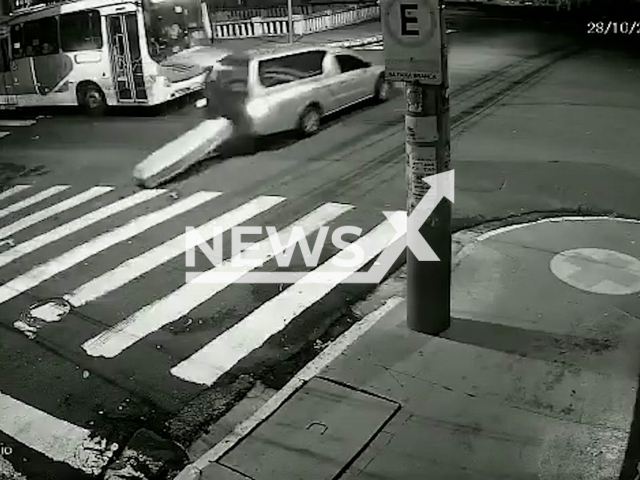 A hearse drops a coffin in the middle of the street in Ribeirao Preto, Sao Paulo state, Brazil, Friday, Oct. 28, 2022. The hearse driver did not notice that the coffin fell.Note: Picture is screenshot from a video (Newsflash).