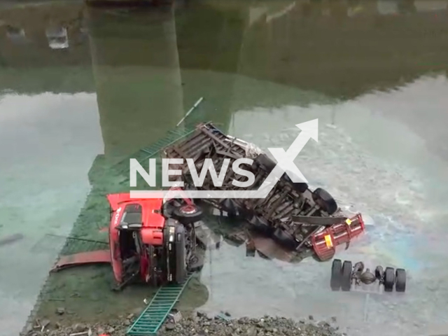 A lorry that failed to negotiate the bend overturned and fell from the bridge into the Coruh River in Artvin, Turkey on 6th March 2022. Note: Picture is a screenshot from a video (Newsflash)