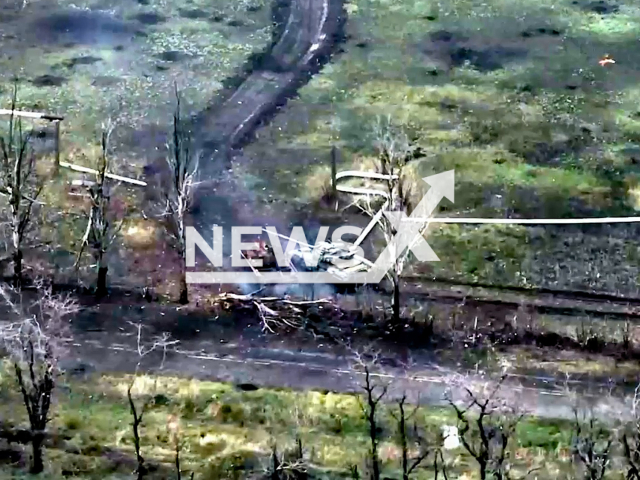 Russian tank moves down the road in a field area in Donetsk region, Ukraine in undated photo. Servicemen of the 79th separate amphibious assault brigade of Mykolaiv destroyed Russian tank and BMP infantry fighting vehicle.  Note: Picture is screenshot from a video (@www.dshv.mil.gov.ua/Newsflash).