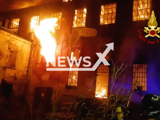 Firefighters extinguish a fire in a court building in Erba, Lombardy, Italy. Note: Picture is a screenshot from a video (@vigilidelfuoco/Newsflash).