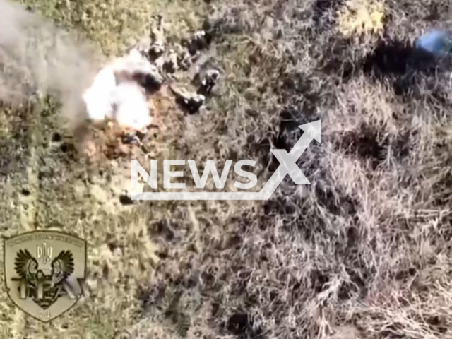 Picture shows an explosion among Russian soldiers in a field area in Ukraine in undated photo. Ukrainian forces dopped bomb from UAV (unmanned aerial vehicle) on a group of Russian soldiers. Note: Picture is screenshot from a video (@AFUStratCom/Newsflash).