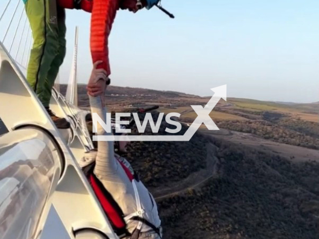 Skydiver, Kevin Marret, 30, prepares to jump from a bridge in Millau, France, in undated footage. Kevin stated that he has approximately 1100 jumps in total. Note: Photo is a screenshot from the video (@kev.paris/Newsflash).