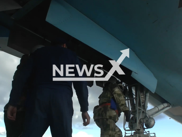 Russian pilots get on the Su-34 fighter-bomber to preform combat flight in Ukraine in undated footage.
The Sukhoi Su-34 is a Soviet-origin Russian twin-engine, twin-seat, all-weather supersonic medium-range fighter-bomber/strike aircraft.
Note: This picture is a screenshot from the video. (Ministry of Defense of Russia/Newsflash)