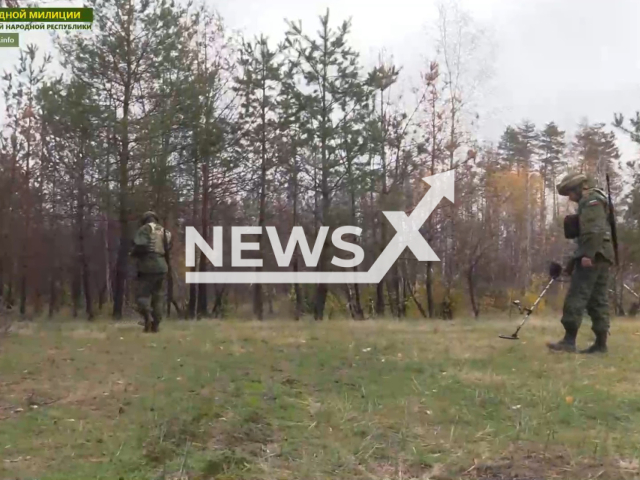 Soldiers of the People's Militia of the LPR work with new modern metal detectors for demining gifted by Russian volunteers in Ukraine in undated footage. Note: Picture is a screenshot from a video (@millnr/Newsflash)