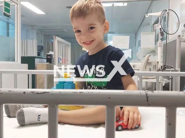 Oliver Romero poses in an undated photo. Oliver, the Malaga-born boy who needs urgent surgery for a brainstem tumour, went down for surgery at the Sant Joan de Deu hospital in Barcelona, Spain Friday, Oct. 28, 2022. Note: Picture is private (@alejandro_underwater/Newsflash)