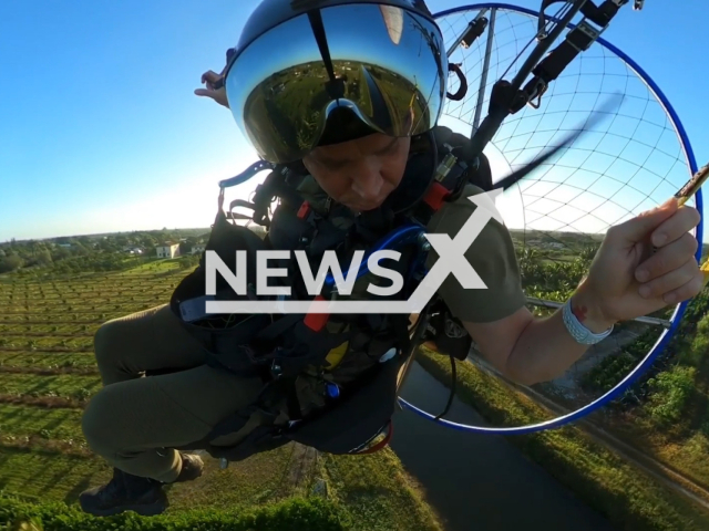 Cristiano Piquet, a Miami real estate agent, paraglides in South Florida in undated footage. Cristiano helped rescue a woman from her submerged car. Note: This picture is a screenshot from the video. (@cristianopiquet/Newsflash)