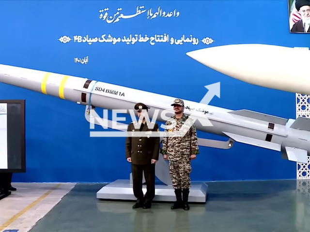 Iran's Defense Minister Brigadier General Mohammad Reza Ashtiani (left) and Alireza Sabahifard (right) pose  with the  Sayyad 4B  missile  in Iran, on Sunday, Nov. 6, 2022. It is part of Iran's missile defence system, a Bavar-373 with an extended engagement range of 300 kilometres. 
Note: Photo is a screenshot from a video. (Newsflash)