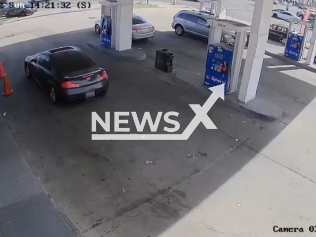 The moment before a man was robbed by four armed thieves at gunpoint in broad daylight as he stops to look at a car for sale near a petrol station in Philadelphia, Pennsylvania, USAThis photo is a screenshot from the video. ( U.S. Navy/Newsflash)