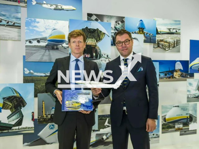 Gotz Ahmelmann (left) and Olesksii Makeiev (right) pose in undated photo. The exhibition "Light and Shadow. The Antonov Story" officially opened at the Leipzig/Halle Airport in Germany in November 2022. Note: Licensed content. (Leipzig, Halle Airport/Newsflash)