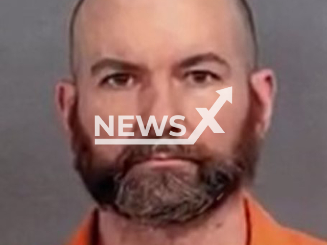 David Dues (48) from Burton, a local teacher and church security member was arrested and charged with 23 felony counts. Note: Police photo(Genesee County Sheriff's Office/Newsflash).