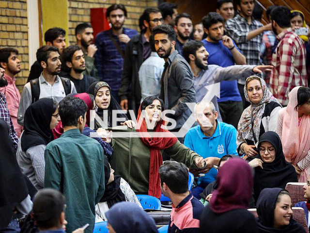 Photo shows Leila Hosseinzadeh (pictured in red scarf) during a protest in an undated photo. Leila Hosseinzadeh, a student in prison, reportedly announced a hunger strike after she was banned from seeing her family. Note: Picture is private (Newsflash)