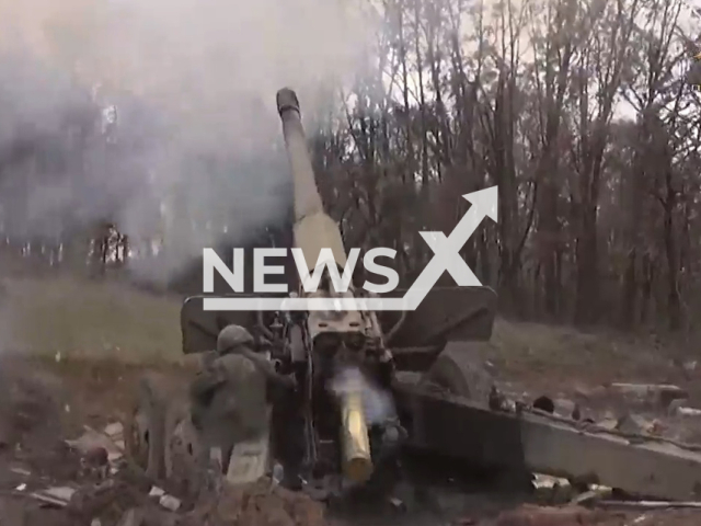 DPR soldier shoots a Giatsint-B towed 152 mm field gun in the village of Pervomaiske, Donetsk region, Ukraine in undated photo. DPR drone operators detected Ukrainian military transport, ammunition depots and strongholds and DPR artillery shot at them with help of Giatsint-B gun. Note: Picture is a screenshot from a video (@nm_dnr/Newsflash)