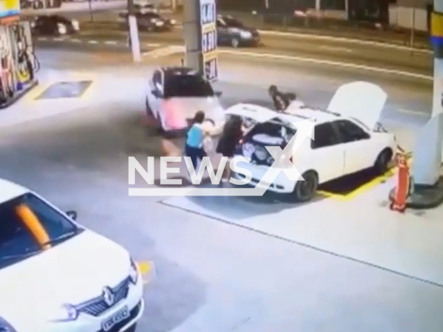 A car drives toward people at gas station, in Sao Paulo, Brazil, on on Sunday, Nov. 6, 2022. 
The driver of the car told police he lost control of car  when it was closed in by a grey vehicle at the entrance to the gas station. Note: Picture is a screenshot from a video (Newsflash)