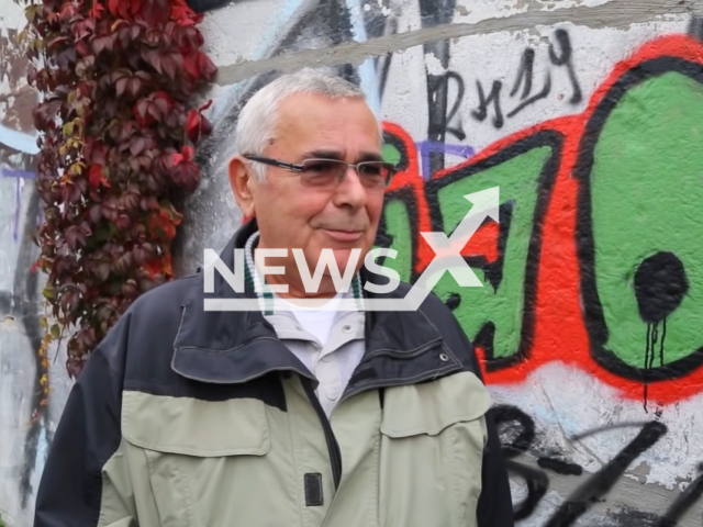 Former East German border guard officer Harald Jaeger, 79, poses in undated photo. He disobeyed orders and opened the Bornholmer Street border crossing of the Berlin Wall on Nov. 9, 1989. Note: Photo is a screenshot from a video. (Newsflash)