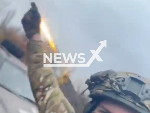 Ukrainian soldier stands behind GRAD multiple rocket launcher in a field area in Ukraine in undated footage. Grad is a self-propelled 122 mm multiple rocket launcher system designed in the Soviet Union. Note: Picture is a screenshot from a video (@AFUStratCom/Newsflash)