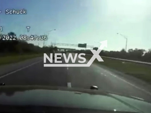 Dashcam video shows trooper Toni Schuck driving into a speeding DUI suspect's path to protect Skyway 10K runners in Florida, USA. Note: Photo is a screenshot from the video (@FLHSMV/Newsflash)