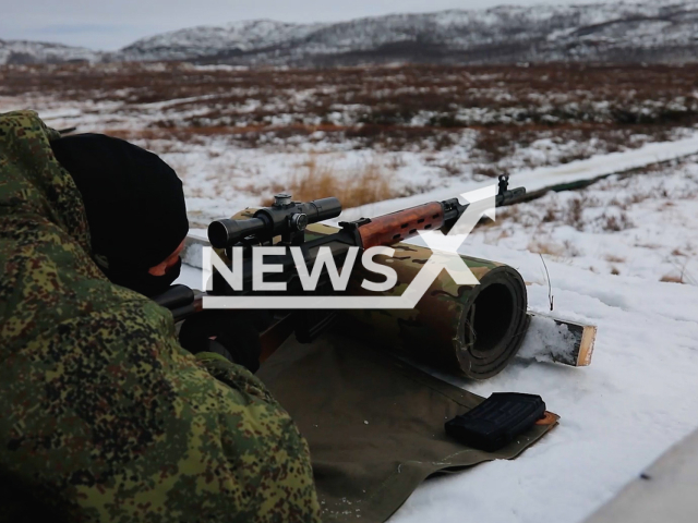 Russian soldier crawl across the frozen snow-covered ground and fire with SVD sniper at targets as part of training at Murmansk region, Russia, undated. The SVD is a semi-automatic marksman rifle with an 800-meter firing range that was developed in the Soviet Union.  Note: Picture is a screenshot from a video (Ministry of Defence of Russia/Newsflash).