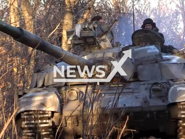 DPR soldier drives T-64BM Bulat tank in the forest belt located behind Opytne settlement, Donetsk region, Ukraine in undated photo. Tankers of the 1st Slavic brigade of the People's Militia of the DPR hit the area where Ukrainian forces are concentrated with help of captured in Mariupol Ukrainian tank. Note: Picture is screenshot from a video (@nm_dnr/Newsflash)