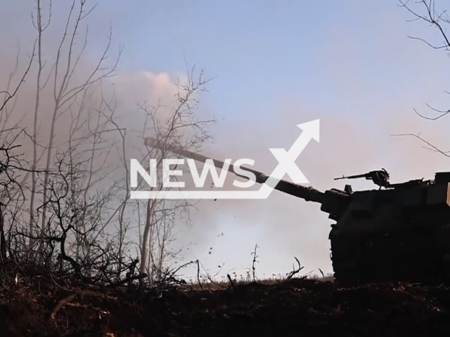 AHS Krab howitzer shoots among trees in Ukraine in undated photo. Ukrainian forces used Polish AHS Krab 155 mm NATO-compatible self-propelled tracked gun-howitzer against Russian invaders. Note: Photo is a screenshot from the video (@GeneralStaff.ua/Newsflash)