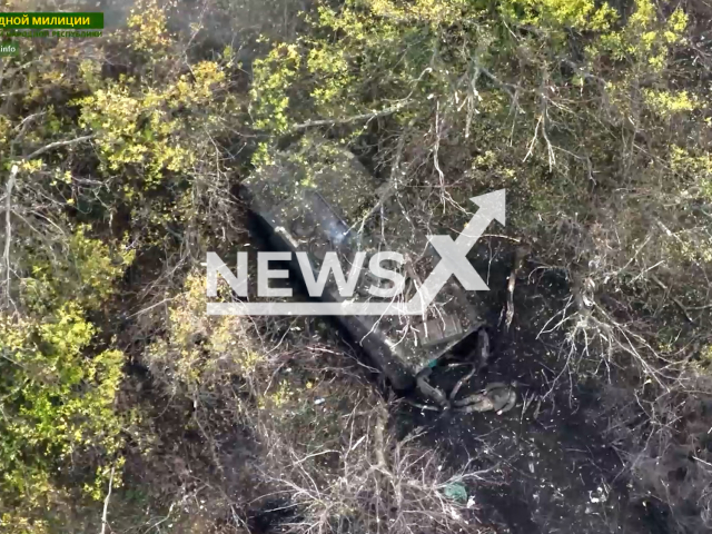 Picture shows damaged Ukrainian military vehicle with wounded soldier near in Spirne settlement, Donetsk region, Ukraine in undated photo. Soldiers of the 4th brigade of the 2nd army corps of the People's Militia of the LPR destroyed the transport and armored vehicles of Ukrainian troops. Note: Picture is screenshot from a video (@millnr/Newsflash)