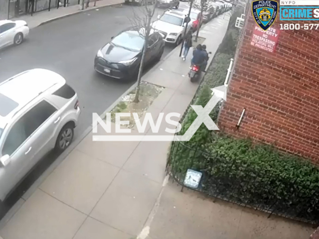 Man on scooter drags 12-year-old girl by the necklace in Queen, New York, USA on Friday, Oct. 28, 2022. The suspects are connected with  7 different cases where the victims were approached in Queens and their necklaces were snatched from their necks. Note: Picture is a screenshot from a video (@NYPDnews/Newsflash)